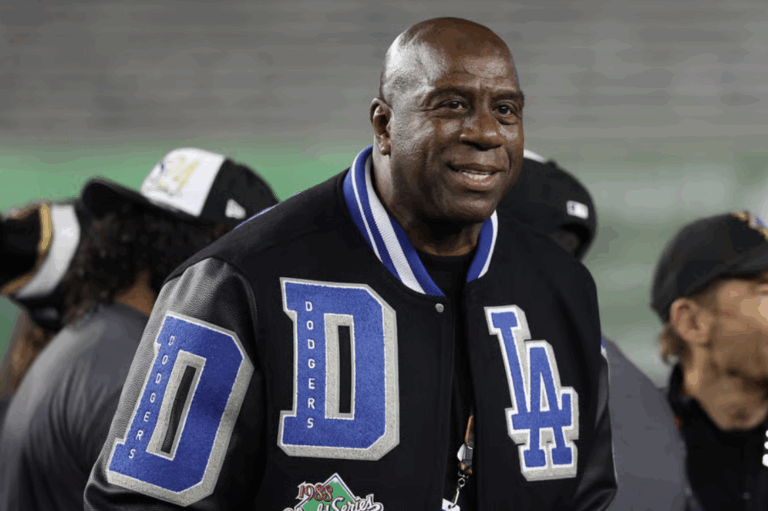 Earvin "Magic" Johnson celebrates with the Los Angeles Dodgers after defeating the New York Yankees during Game Five of the 2024 World Series at Yankee Stadium on October 30, 2024 in New York City. The Dodgers defeated the Yankees 7-6. (Photo by Elsa/Getty Images)